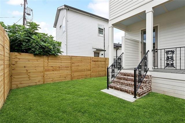 view of yard with a fenced backyard