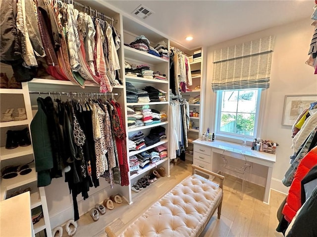 spacious closet with visible vents and wood finished floors