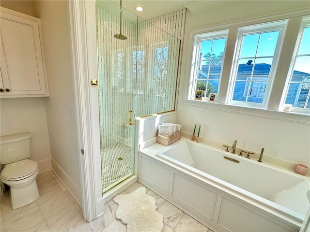 full bath with a garden tub, marble finish floor, toilet, a shower stall, and baseboards