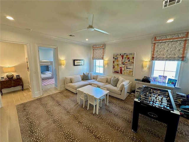 living room featuring recessed lighting, visible vents, ceiling fan, and crown molding