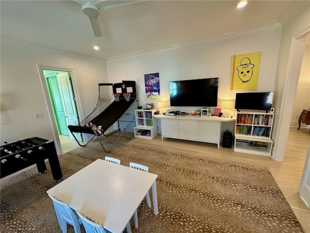 game room featuring ceiling fan, recessed lighting, and ornamental molding