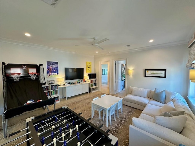 living area with a ceiling fan, recessed lighting, visible vents, and ornamental molding