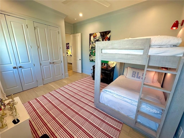 bedroom featuring a closet, recessed lighting, and light wood-style floors