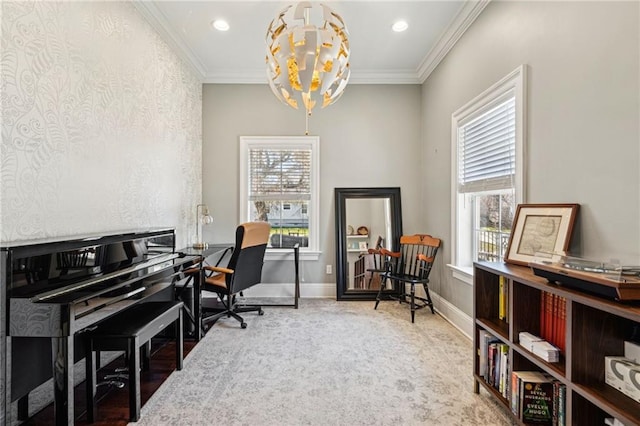 office area with a notable chandelier, a healthy amount of sunlight, crown molding, and baseboards