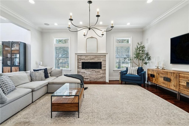 living area with a stone fireplace, wood finished floors, and ornamental molding