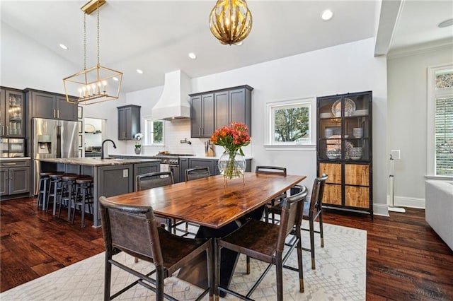 dining space featuring recessed lighting, dark wood-type flooring, and a healthy amount of sunlight