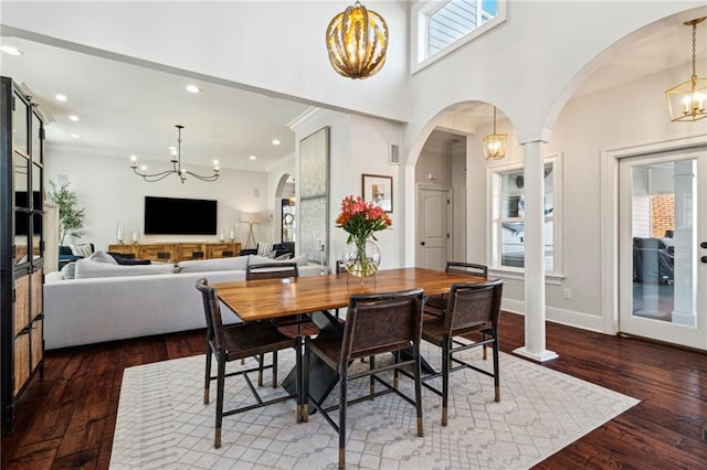 dining space featuring an inviting chandelier and wood finished floors