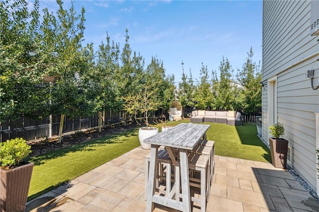 view of patio featuring outdoor lounge area and a fenced backyard