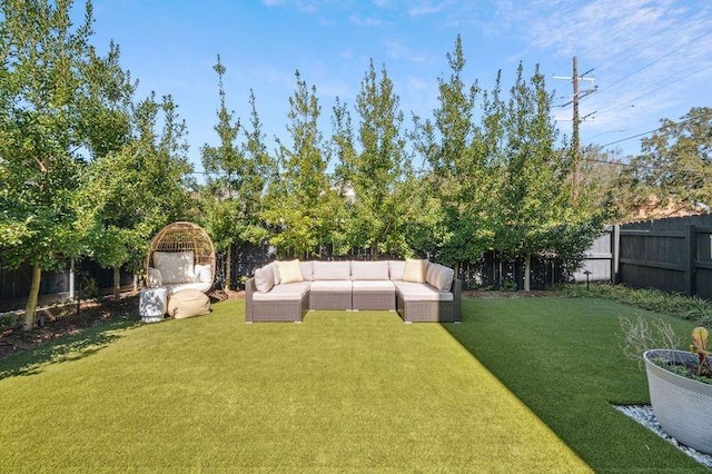 view of yard featuring outdoor lounge area and a fenced backyard