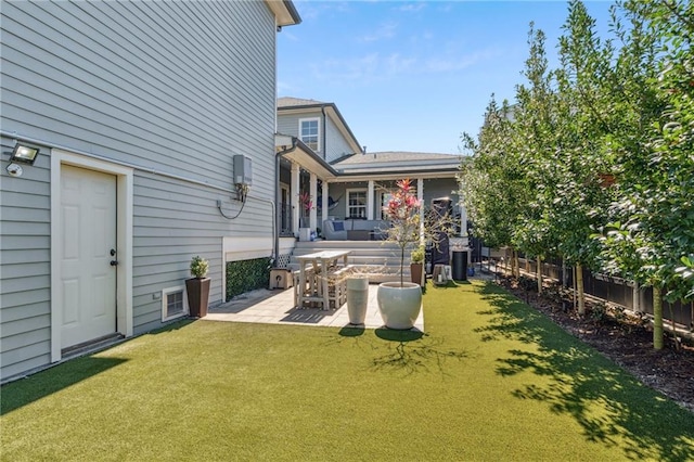 view of yard featuring a patio and fence