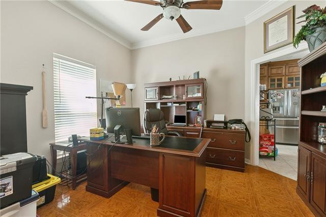 home office with ornamental molding and ceiling fan