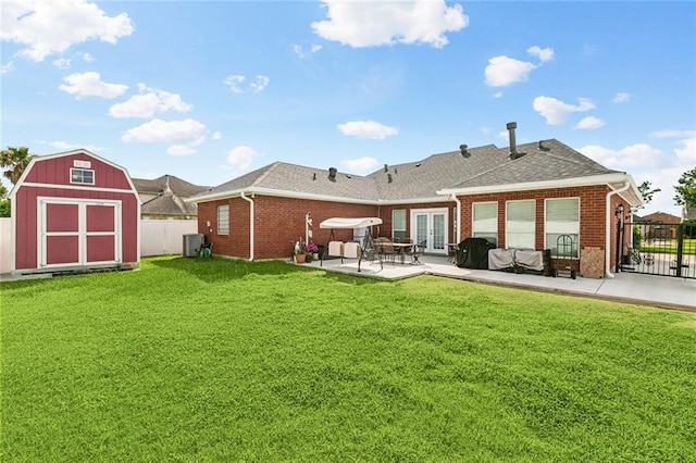 3408 Debouchel Blvd, Meraux, LA 70075 - back of property with french doors, brick siding, a patio, and a shed