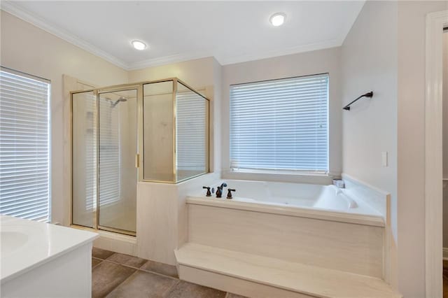 full bath with tile patterned floors, ornamental molding, a stall shower, a bath, and vanity