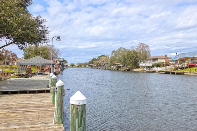 view of dock featuring a water view and boat lift