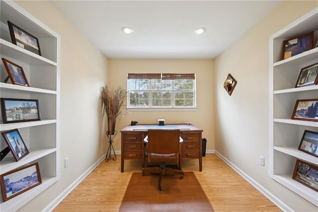 office space with built in features, recessed lighting, baseboards, and wood finished floors