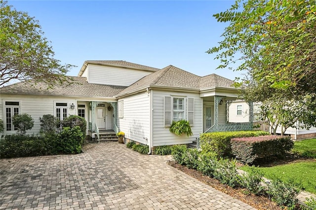 view of front of property with roof with shingles