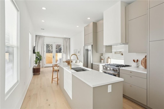 kitchen with gray cabinets, french doors, high quality appliances, and modern cabinets