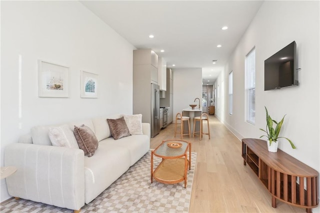 living room featuring recessed lighting and light wood finished floors