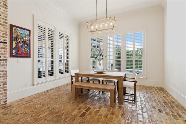 dining room with baseboards, brick floor, and ornamental molding