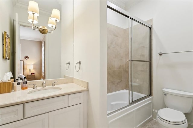 full bathroom with crown molding, bath / shower combo with glass door, toilet, ensuite bath, and vanity