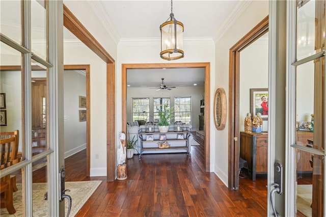 entryway featuring ornamental molding, french doors, baseboards, ceiling fan, and dark wood-style flooring