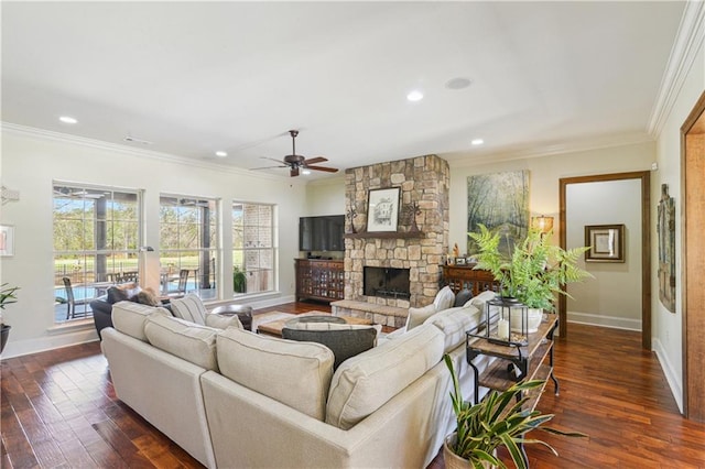 living area with dark wood-type flooring, a fireplace, and ornamental molding