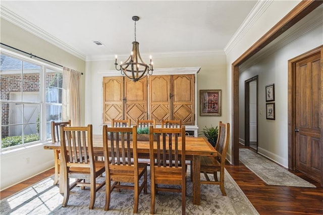 dining area with dark wood finished floors, visible vents, a chandelier, and crown molding