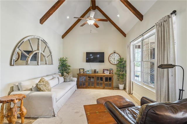 carpeted living room featuring ceiling fan, beam ceiling, and high vaulted ceiling