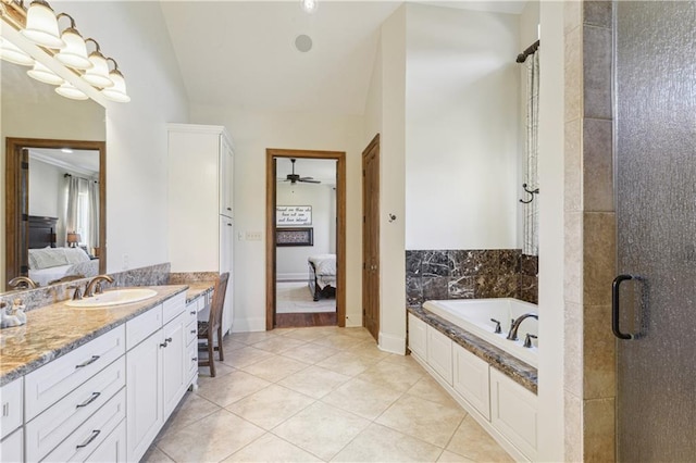 ensuite bathroom featuring vanity, ensuite bath, a stall shower, tile patterned flooring, and a garden tub