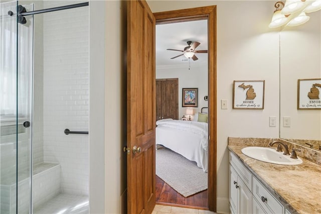 ensuite bathroom featuring ensuite bath, a shower stall, crown molding, ceiling fan, and vanity