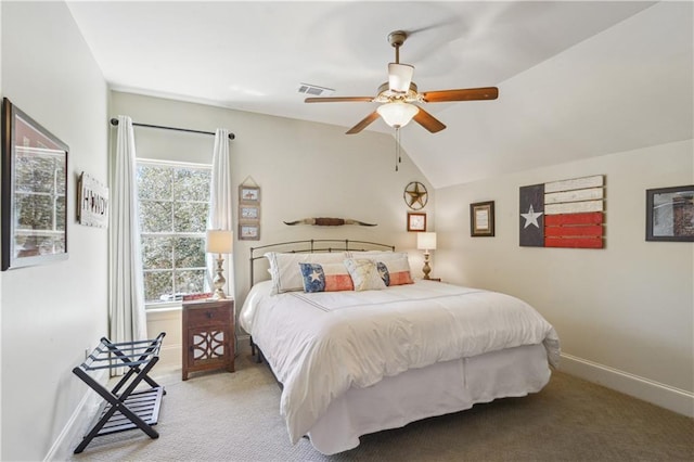 bedroom featuring visible vents, light colored carpet, baseboards, and lofted ceiling