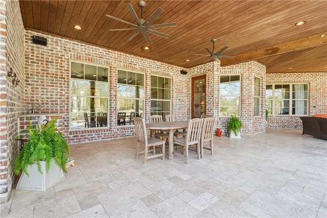 view of patio with ceiling fan and outdoor dining space