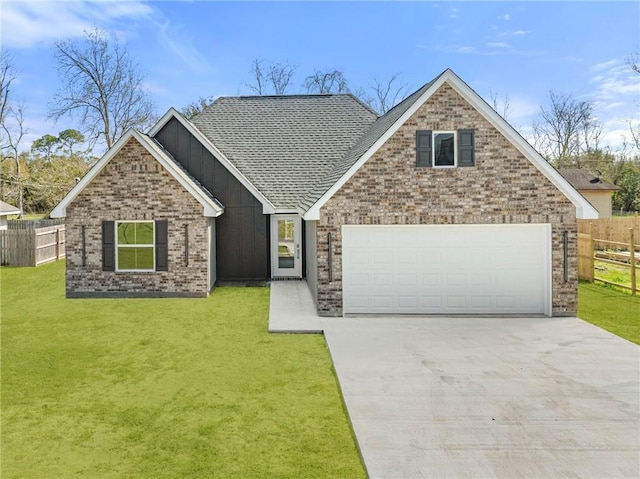 view of front of home with concrete driveway, a front lawn, and fence