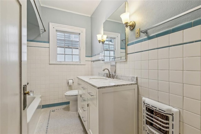 full bath with toilet, ornamental molding, heating unit, tile walls, and tile patterned flooring