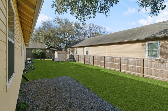view of yard featuring a shed and an outbuilding