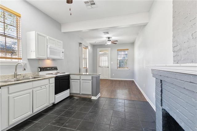 kitchen featuring white appliances, a sink, ceiling fan, a peninsula, and beamed ceiling