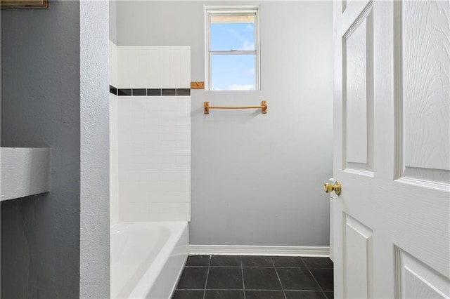 bathroom with tile patterned floors and baseboards