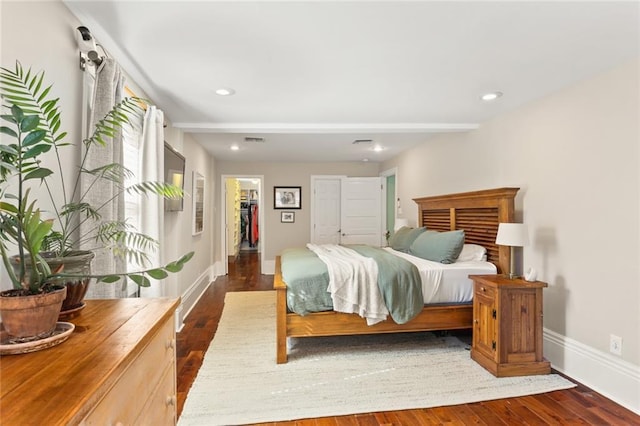 bedroom featuring recessed lighting, visible vents, baseboards, and wood finished floors