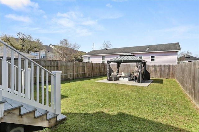 view of yard with a gazebo, a fenced backyard, and a patio