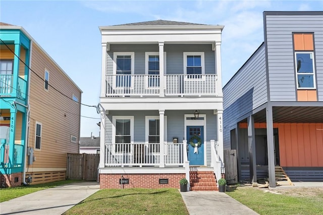 view of front of home with a porch and a front yard