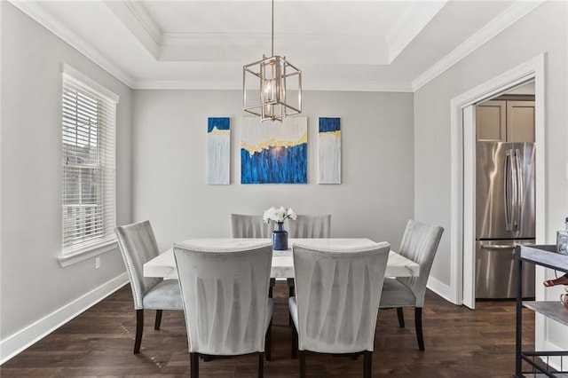 dining space featuring baseboards, a raised ceiling, dark wood-style floors, and a chandelier