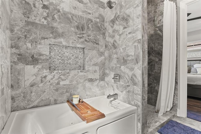 ensuite bathroom with a tile shower, ensuite bathroom, and a whirlpool tub