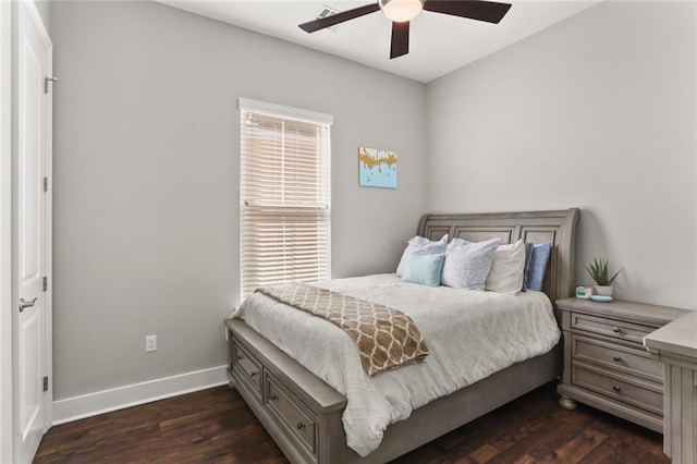 bedroom featuring dark wood finished floors, ceiling fan, and baseboards