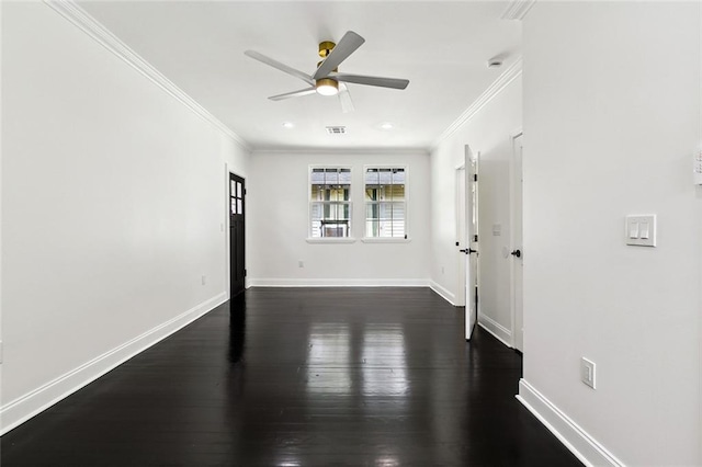 spare room with visible vents, ceiling fan, baseboards, ornamental molding, and dark wood-style flooring