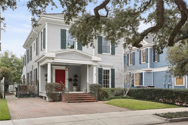 view of front of house with fence