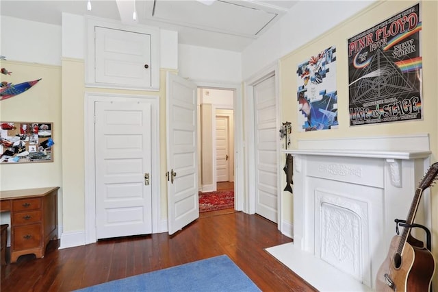 interior space featuring dark wood-style floors and baseboards