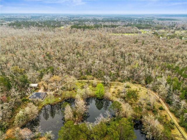 birds eye view of property with a wooded view