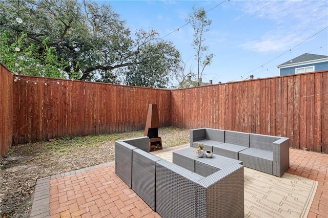 view of patio / terrace featuring an outdoor hangout area and a fenced backyard