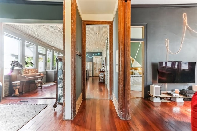 interior space with visible vents and wood-type flooring