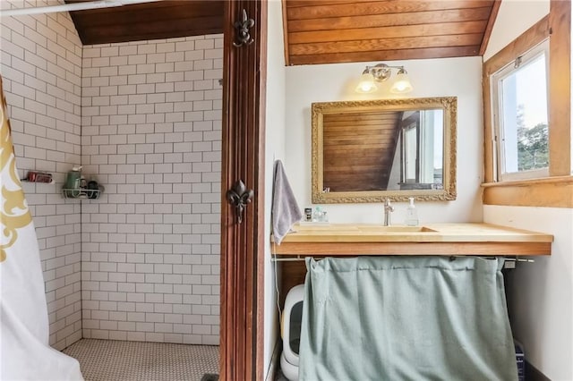 full bathroom with wood ceiling, a stall shower, vanity, and lofted ceiling